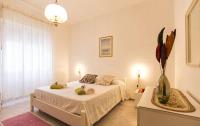 A bed or beds in a room at Cervi flat close to the sea and the historic centre of Alghero