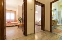 A bed or beds in a room at Cervi flat close to the sea and the historic centre of Alghero