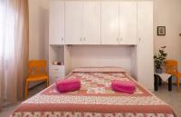 A bed or beds in a room at Cervi flat close to the sea and the historic centre of Alghero