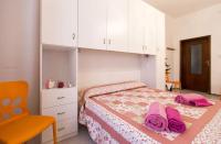 A bed or beds in a room at Cervi flat close to the sea and the historic centre of Alghero
