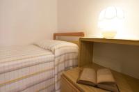 A bed or beds in a room at Cervi flat close to the sea and the historic centre of Alghero