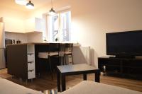 A kitchen or kitchenette at Ager Apartments