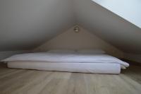 A bed or beds in a room at Ager Apartments