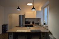 A kitchen or kitchenette at Ager Apartments