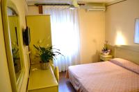 Łóżko lub łóżka w pokoju w obiekcie Hotel Ezzelino