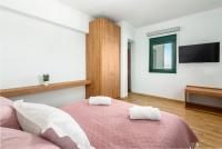 Łóżko lub łóżka w pokoju w obiekcie Siena Pool Villa