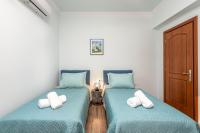 Łóżko lub łóżka w pokoju w obiekcie Siena Pool Villa