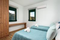 Łóżko lub łóżka w pokoju w obiekcie Siena Pool Villa