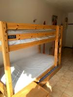 a couple of bunk beds in a room at 155 Piste dans mon canapé in Châtel