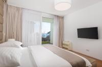 Posteľ alebo postele v izbe v ubytovaní Apartment Lara with rooftop swimming pool