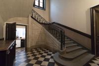 a staircase in a house with a checkered floor at Le Parvis-Beau Duplex centre in Rennes