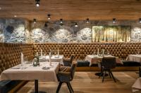 Εστιατόριο ή άλλο μέρος για φαγητό στο Hüttenhof - Wellnesshotel & Luxus-Bergchalets - Adults only