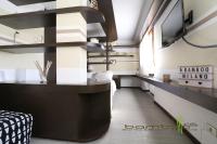 Televízia a/alebo spoločenská miestnosť v ubytovaní Bamboo Milano Vico