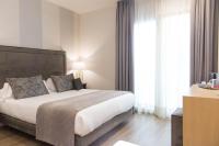 Postel nebo postele na pokoji v ubytování Hotel Palacete de Alamos