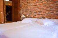 A bed or beds in a room at Apartamentos Turísticos Toledo