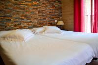 A bed or beds in a room at Apartamentos Turísticos Toledo