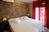 A bed or beds in a room at Apartamentos Turísticos Toledo