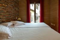 A bed or beds in a room at Apartamentos Turísticos Toledo