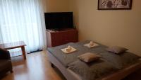 Posteľ alebo postele v izbe v ubytovaní Niki Apartman