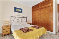 A bed or beds in a room at Blue Sky apartment