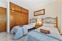 A bed or beds in a room at Blue Sky apartment