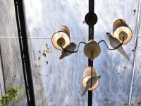 a group of lights hanging from a wall at DG Hotel in Taipei