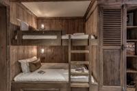 a bunk bed room with two bunk beds at HOTEL LE VAL D&#39;ISERE in Val-d&#39;Isère