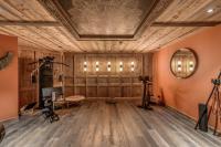a room with wooden walls and a ceiling with lights at HOTEL LE VAL D&#39;ISERE in Val-d&#39;Isère