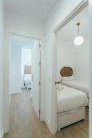 Łóżko lub łóżka w pokoju w obiekcie Modern with balcony- 2Bd 2Bth- San Vicente