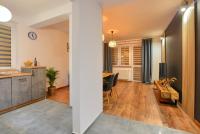 Televízia a/alebo spoločenská miestnosť v ubytovaní Apartamenty Maja i Zuzia