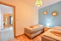 Posteľ alebo postele v izbe v ubytovaní Apartamenty Maja i Zuzia