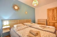 Posteľ alebo postele v izbe v ubytovaní Apartamenty Maja i Zuzia
