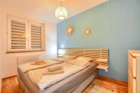 Posteľ alebo postele v izbe v ubytovaní Apartamenty Maja i Zuzia