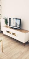 Televízia a/alebo spoločenská miestnosť v ubytovaní Primo Apartments Tramwajowa 17B
