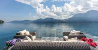 a group of chairs on a boat on a body of water at Hotel Stadler am Attersee in Unterach am Attersee