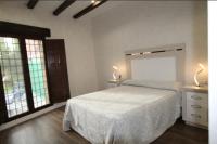 A bed or beds in a room at Casa Rural EL CAMPICO