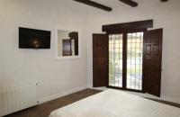 A bed or beds in a room at Casa Rural EL CAMPICO