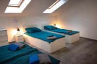 Posteľ alebo postele v izbe v ubytovaní Osada Słuszewo - Apartamenty Restauracja Wydarzenia