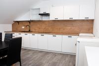 Kuchyňa alebo kuchynka v ubytovaní Osada Słuszewo - Apartamenty Restauracja Wydarzenia