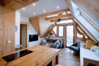 Posedenie v ubytovaní Apartament Tatry Folk regionalny Grota Solna
