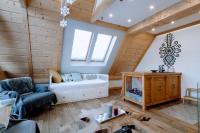 Posteľ alebo postele v izbe v ubytovaní Apartament Tatry Folk regionalny Grota Solna