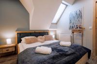 Posteľ alebo postele v izbe v ubytovaní Apartament Tatry Folk regionalny Grota Solna