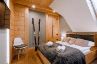 Posteľ alebo postele v izbe v ubytovaní Apartament Tatry Folk regionalny Grota Solna