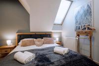 Posteľ alebo postele v izbe v ubytovaní Apartament Tatry Folk regionalny Grota Solna