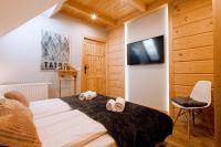 Posteľ alebo postele v izbe v ubytovaní Apartament Tatry Folk regionalny Grota Solna