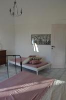 A bed or beds in a room at Casa Carmela
