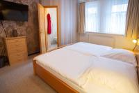 Postel nebo postele na pokoji v ubytování Gruppenhaus St Andreasberg Braunlage Harz
