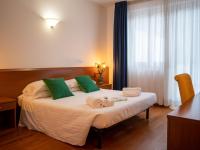 Posteľ alebo postele v izbe v ubytovaní Hotel New Genziana