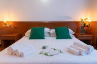 Posteľ alebo postele v izbe v ubytovaní Hotel New Genziana