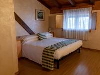 Posteľ alebo postele v izbe v ubytovaní Hotel New Genziana
